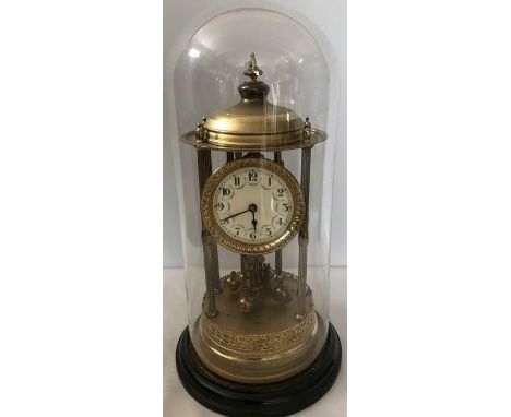 Glass dome cased brass anniversary mantle clock approx 43.5cms h