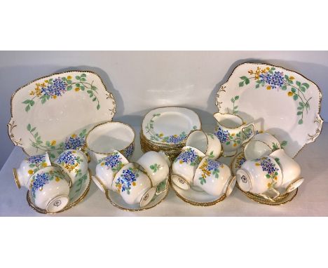 Royal Stafford bone china tea service. 12 place, all good condition apart from discolouration to one cup and chips to 2 plate