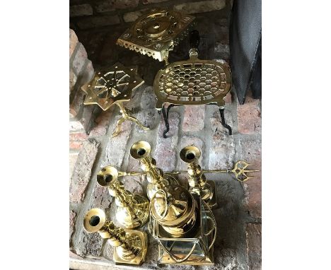 Brass ware including kettle stands, candlesticks, toasting fork and lamp. 