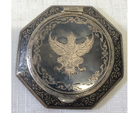 A Siam silver compact.