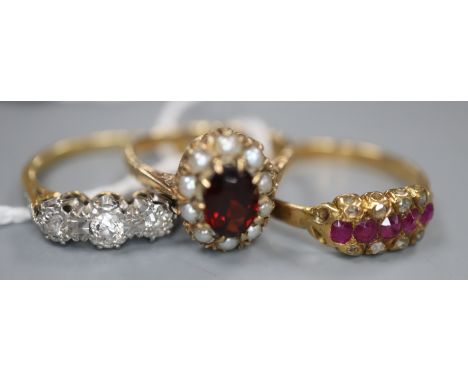 Two 18ct and gem set rings including a three stone diamond ring and a ruby and diamond ring, gross 5.6 grams and a 9ct gold g