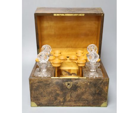 A Victorian pressed glass decanter part set, four decanters and four tots, within fitted brass mounted burr walnut case, 31cm