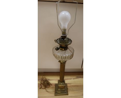 A Victorian brass stem oil lamp, height 58cm excl light fitting