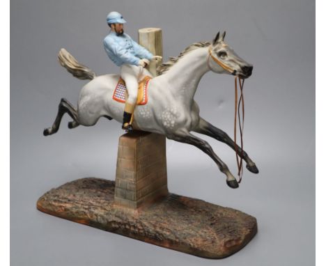 A cast coloured bisque porcelain horse and jockey group, height 26cmCONDITION: Horse tail appears to end quite abruptly, alth