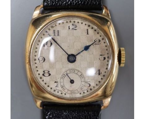 A gentleman's early 1930's 9ct gold manual wind wrist watch, with checkered dial, on later strap.
