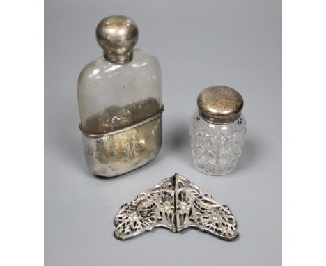 A late Victorian silver mounted glass hip flask, Sheffield, 1890, 14.3cm, an Edwardian silver belt buckle and mounted toilet 