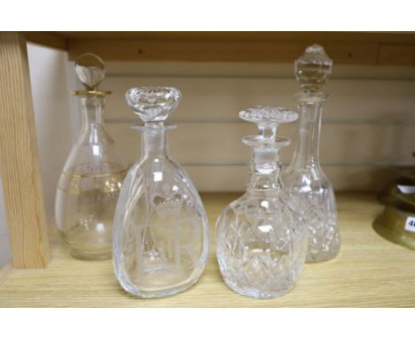A silver Jubilee 1977 commemorative etched decanter and stopper and three other glass decanters, tallest 29cm