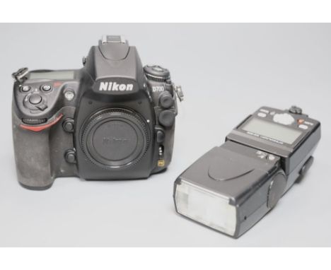 A Nikon D700 SLR camera body with a Nikon flash gun