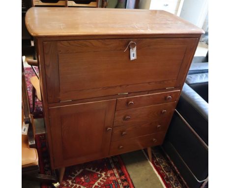 An Ercol cocktail cabinet, width 98cm, depth 46cm, height 150cm