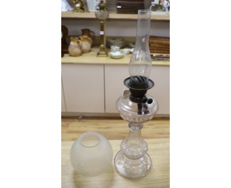 An Edwardian cut glass oil lamp