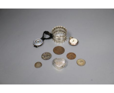 A silver and enamel wrist watch, a silver napkin ring, silver pill box and five assorted worn coins.