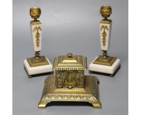 A pair of ormolu mounted alabaster candlesticks, 18cm and a cast brass inkwell with ceramic liner, 14cm wide