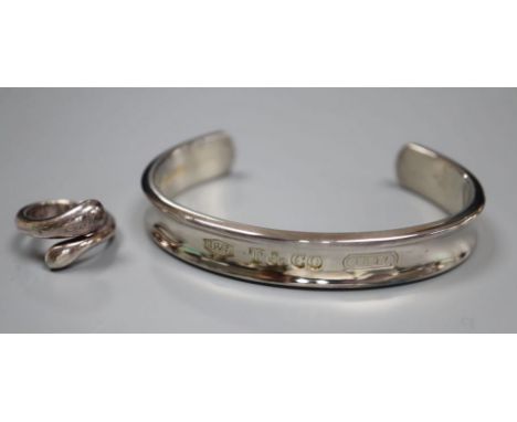 A modern Tiffany and Co 925 snake ring, size M and a Tiffany &amp; Co 925 bangle, both with pouch and box.