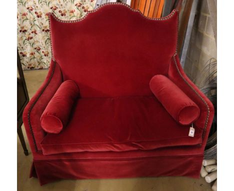 An Yves Halard two-seater sofa covered in red velvet, width 125cm depth 85cm height 132cm