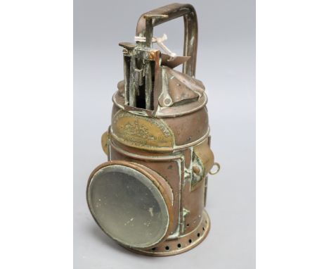 An R. Brown &amp; Sons copper railway lamp, height 25cmCONDITION: Has fuel tank, burner and reflector. One interior glass mis