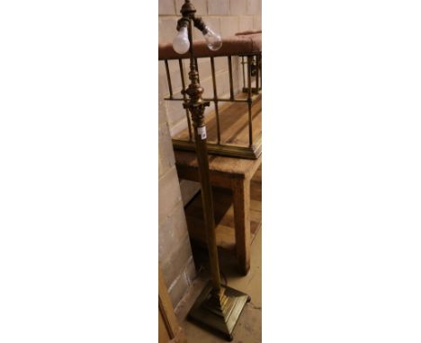 A brass Corinthian column adjustable standard lamp