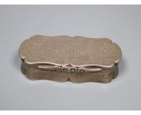 A late Victorian engraved silver shaped oval snuff box, Colen Hewer Cheshire, Birmingham, 1893, 82mm, 89.4 grams.