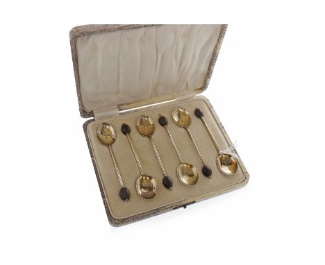 SET OF SIX SILVER BEAN TOP COFFEE SPOONSthe bowls with enamel backs, Birmingham 1928 also a four division wire pattern toast 