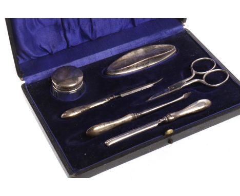 GEORGE VI SILVER MOUNTED CUTICLE SETmaker R. U. & Co. Ltd., Birmingham 1945-6, comprising nail file, scissors, lidded jar, na
