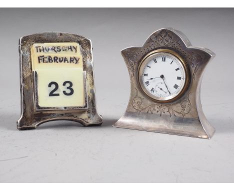 An Edwardian silver mounted desk clock with engraved decoration, white enamel dial with Roman numerals and a silver mounted d