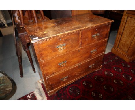A stained pine chest of two long and two short drawers, on bracket supports, 35" wide x 17" deep x 30" high 