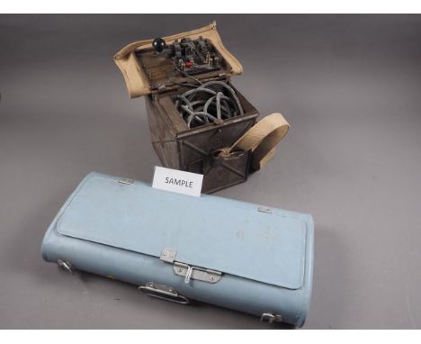 Two WWII signalling lights and a German light blue tin hinged box, 18" wide 