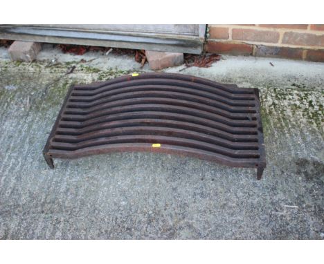 A cast iron fire grate, 29" wide x 15 1/2" deep x 7" high 