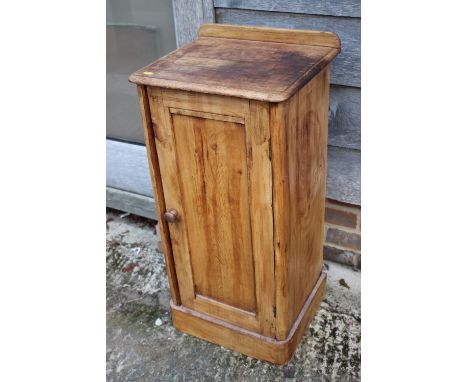 A 19th century stripped pine bedside cupboard enclosed panel door, on block base, 15 1/2" wide x 13 1/2" deep x 32" high 