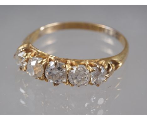 An 18ct gold and diamond five stone dress ring, size Q, 2.6g 