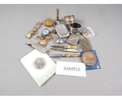 A Platignum fountain pen, a silver napkin ring, a pewter spirit flask, a number of enamel badges, various other costume jewel