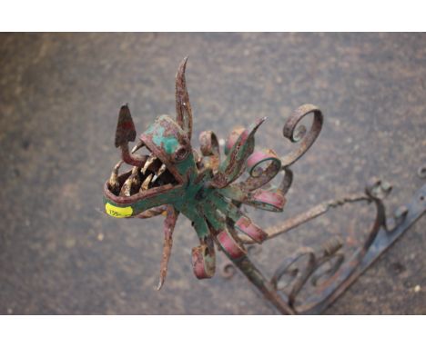 A wrought iron and painted dragon wall bracket for a hanging sign, 32" long 