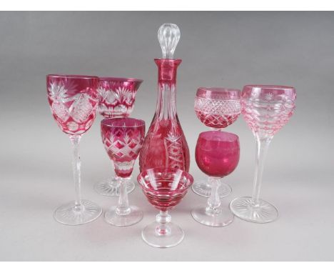 Five ruby glass and cut wines, three smaller similar glasses, a decanter and stopper 