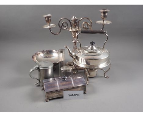 A quantity of silver plate, including a tea kettle and burner, six pewter mugs, dressing table jars, a two-light candelabra, 