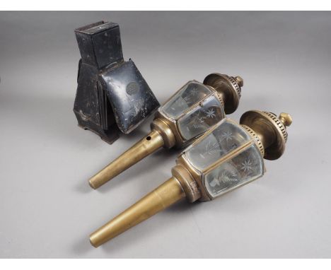 A Lancasters "The Rubralux" darkroom lamp, 11" high, and a pair of brass and glass coaching lamps, 20" high overall 