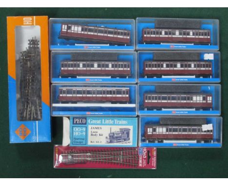 Seven Peco OO9 Gauge Cased Coaches, Ref No's GR-400A (2), GR-400B, GR4207 (2), GR420B and GR440A; plus ten pieces of loose tr