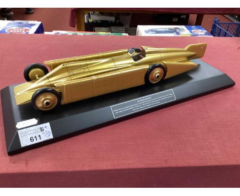 A Bravo Delta Models Golden Arrow Land Speed Record Car, 35cm length, scratches to plinth noted, boxed.PLINTH IS A COMPOSITE 