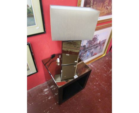 Modern mirror-top table and matching table lamp