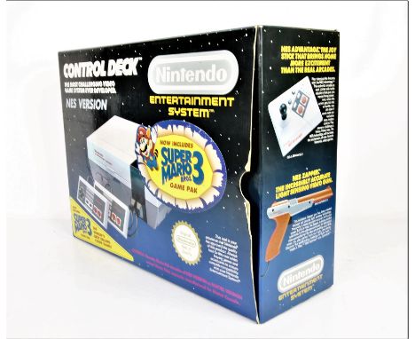 Nintendo Entertainment System - NES - Mario 3 console - Boxed with Game. This lot contains Nintendo's iconic 8-Bit system box