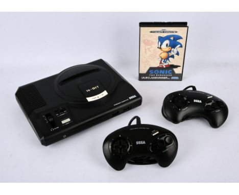 Sega Mega Drive Console. This lot contains a Sega Mega Drive Model 1 console (white label). This item also comes with a boxed