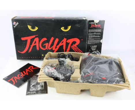 Atari Jaguar multimedia System - Boxed with Games. This lot contains a boxed Atari Jaguar. The owner states the item has neve
