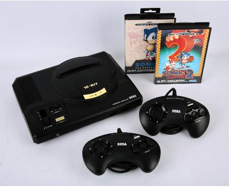 Sega Mega Drive Console. This lot contains a Sega Mega Drive Model 1 console (white label). This item also comes with a boxed