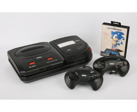 Sega Mega Drive & Sega Mega CDThis lot contains a Sega Mega Drive/Mega CD bundle. This lot features the Mega Drive 2 model an