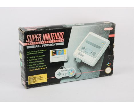 Super Nintendo Console - SNES - PAL - Boxed.  This lot contains Nintendo's 16-Bit system boxed with a copy of Super Mario Wor
