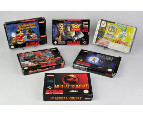 Super Nintendo SNES Boxed Game collection This collection features six SNES games, all boxed that individually have a seconda