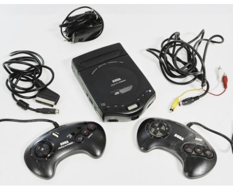 Sega Multi-Mega Console UnboxedThis lot contains the Sega Multi Mega, a device capable of playing both Mega Drive Cartridges 