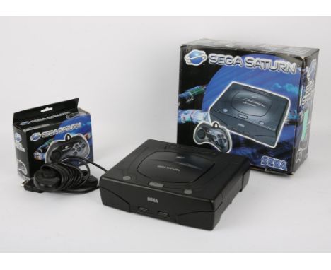 Sega Saturn Console - Model 2 Black - Boxed & Additional Control Pad. This lot contains a boxed Sega Saturn model 2 with all 