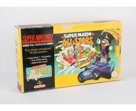Super Nintendo Console - SNES - Mario All Stars console - Boxed. This lot contains Nintendo's 16-Bit system boxed with a copy