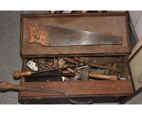 A vintage wooden box of tools To include saws, hammers, ruler, various chisels, etc. (qty) 