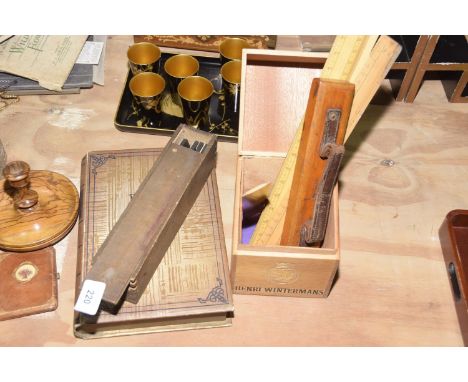 A group of collectible itemsTo include five wooden rulers, a vintage wooden pencil case with leather handle, a wooden cased s