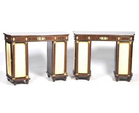 A pair of Regency style twin pedestal console tables, late 19th / early 20th Century Each table with a shaped top above a fri